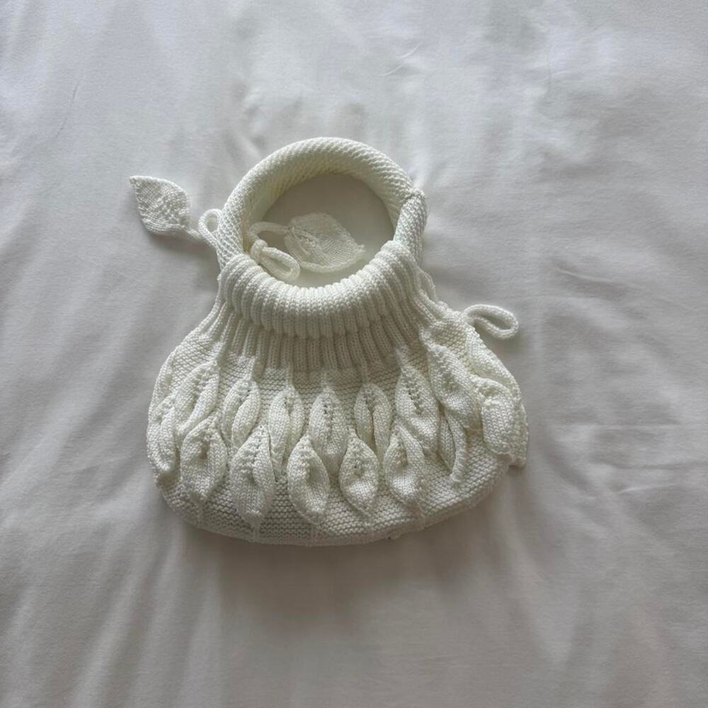White knitted bag with leaf like patterns